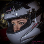 Close-up of person in white racing helmet
