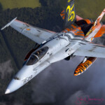 Tiger-striped fighter jet in flight