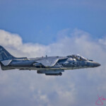 USMC Harrier jet flying through clouds
