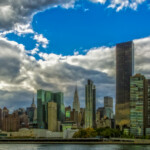 New York City skyline under dramatic cloudy sky