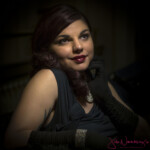 Glamorous woman in evening dress and gloves